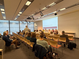 Participants engaging after presentations.